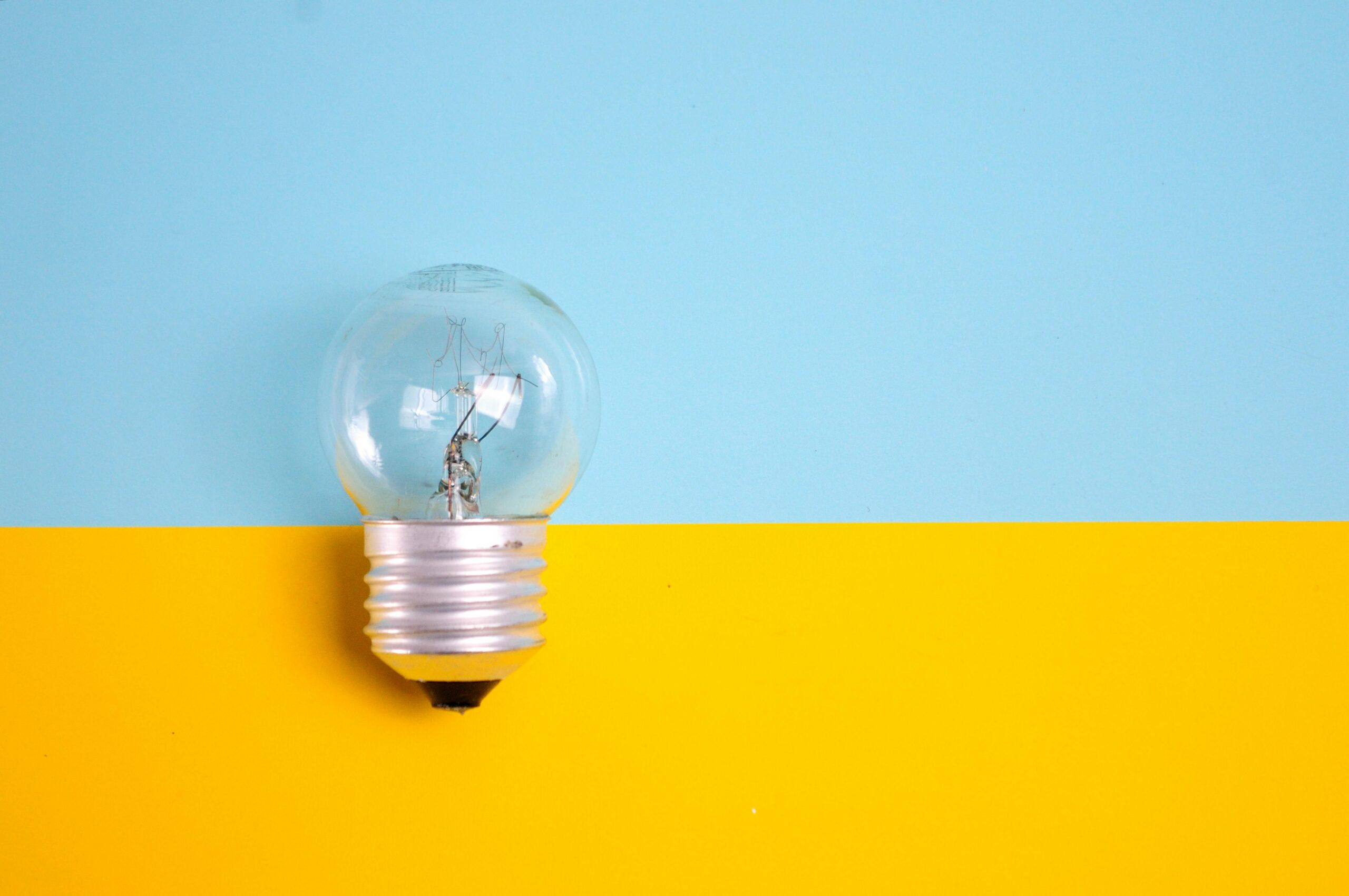 Lightbulb against a blue and yellow background